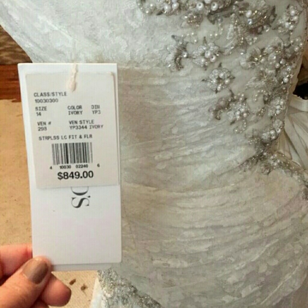 Ivory wedding gown new with tags